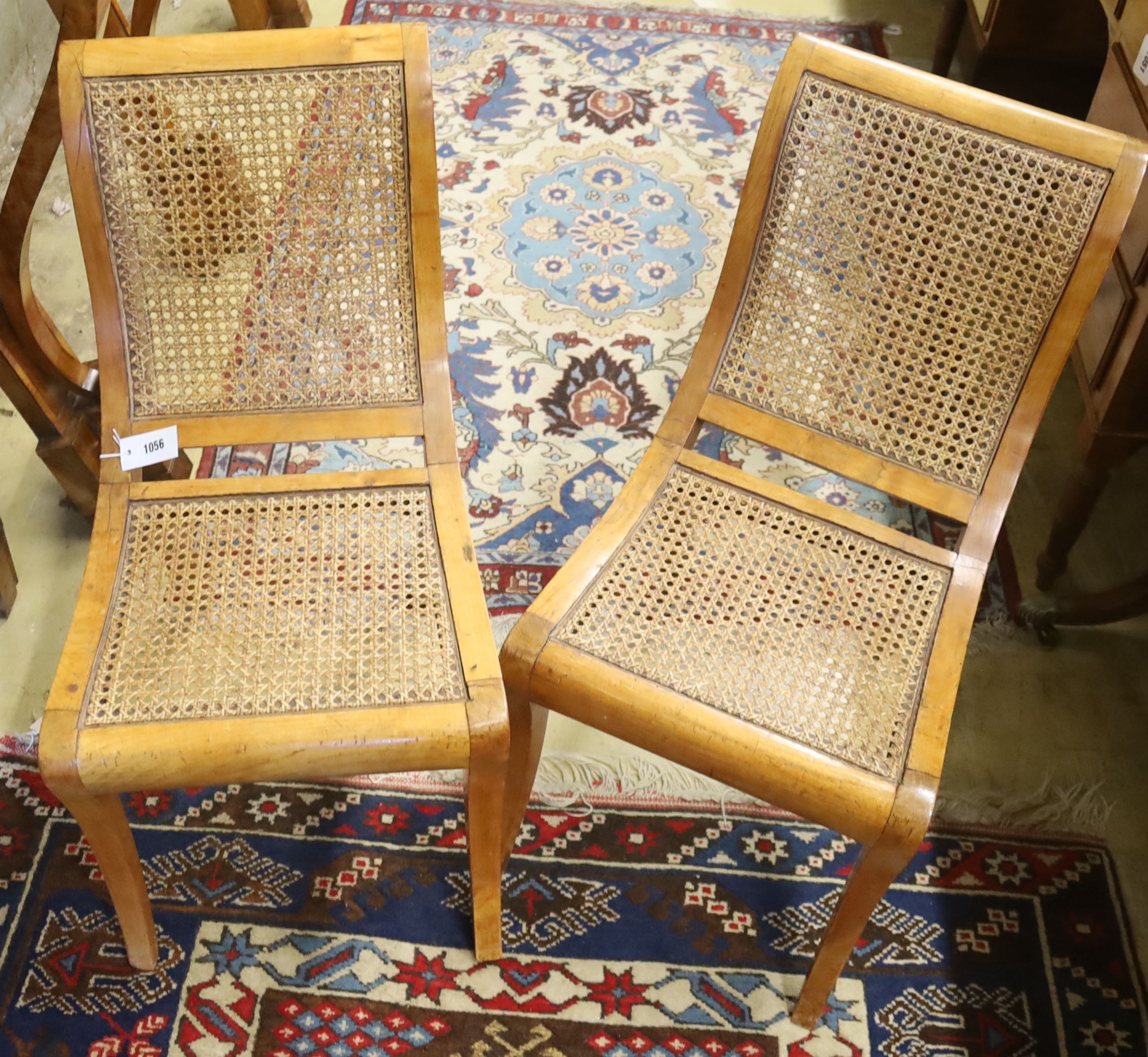 A pair of Italian caned side chairs